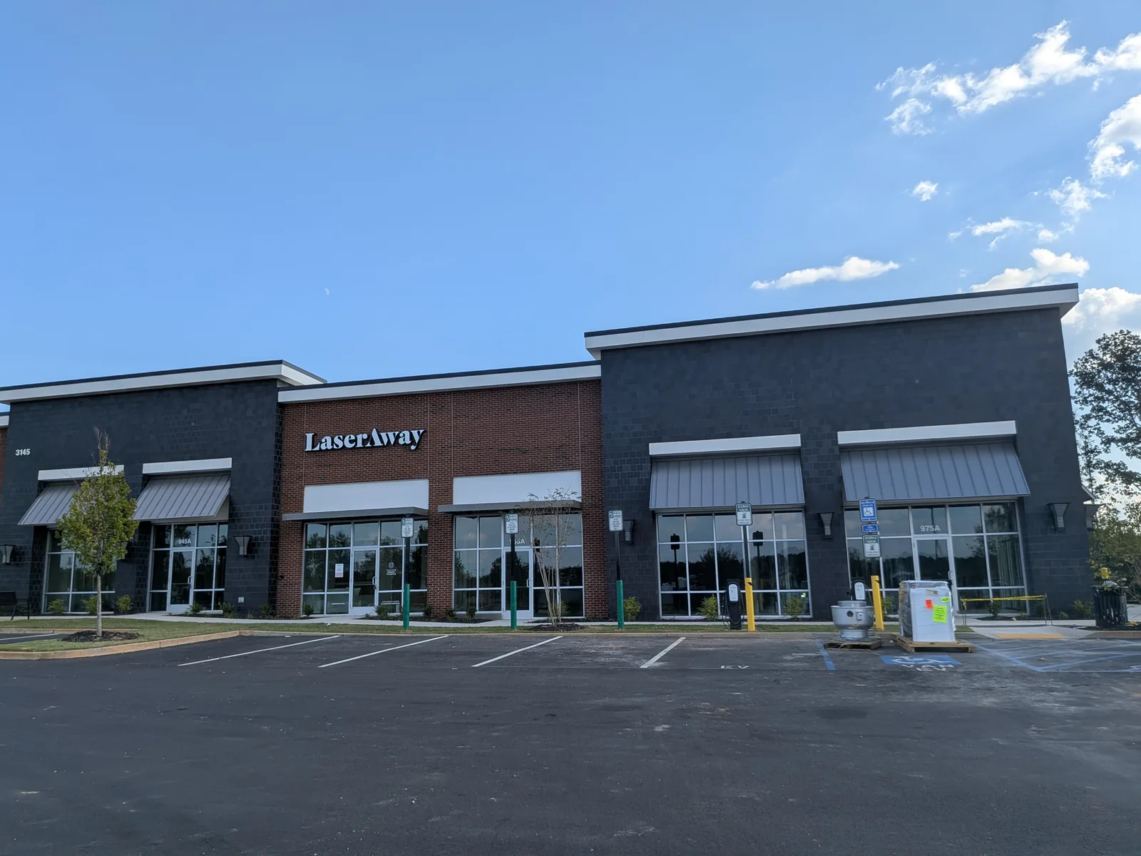 LaserAway signage on an inline retail building at Forsyth Town Center